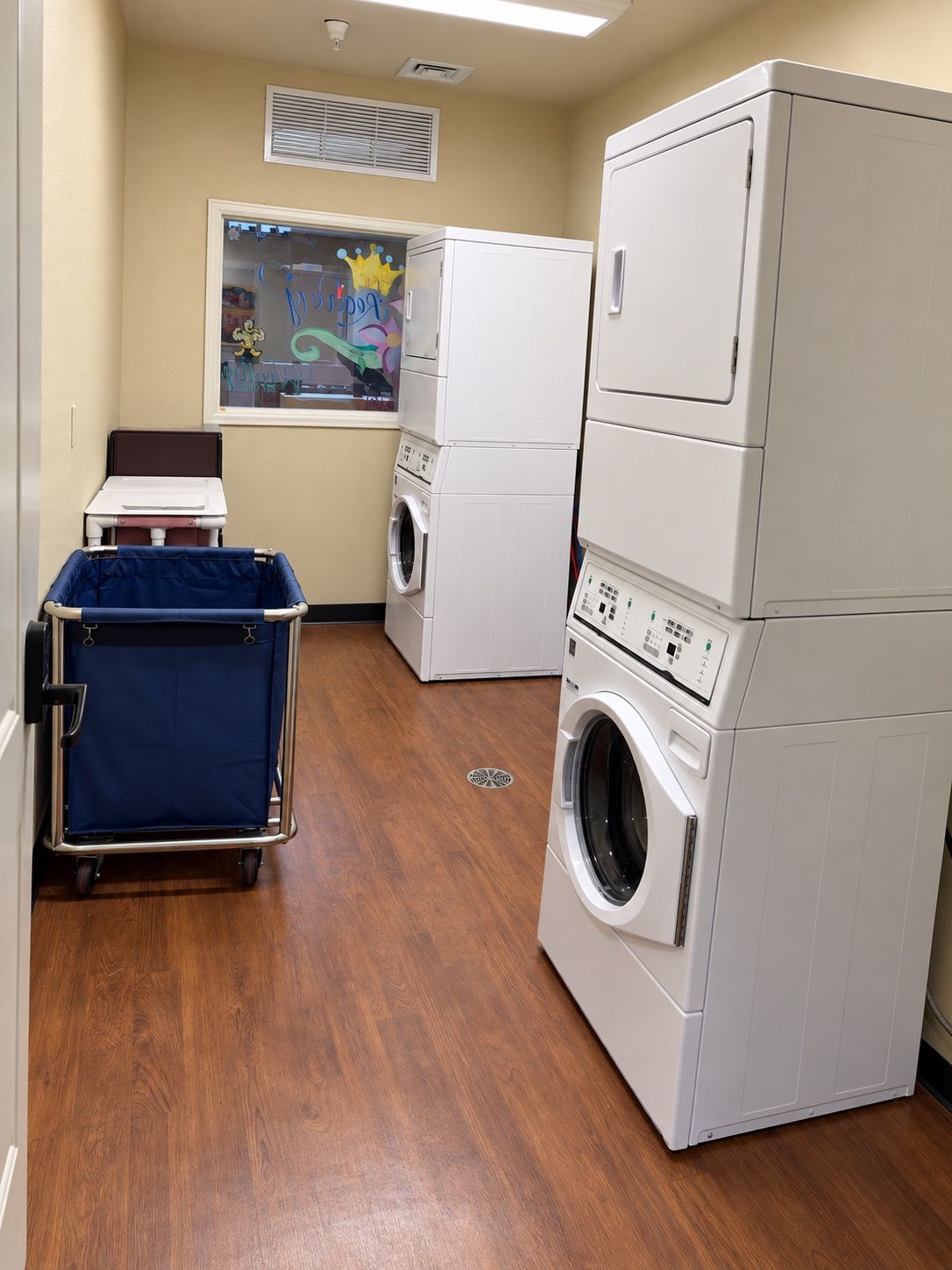 The laundry room at Spring Grove Recovery in Colorado Springs, Colorado, with stacked washers and dryers