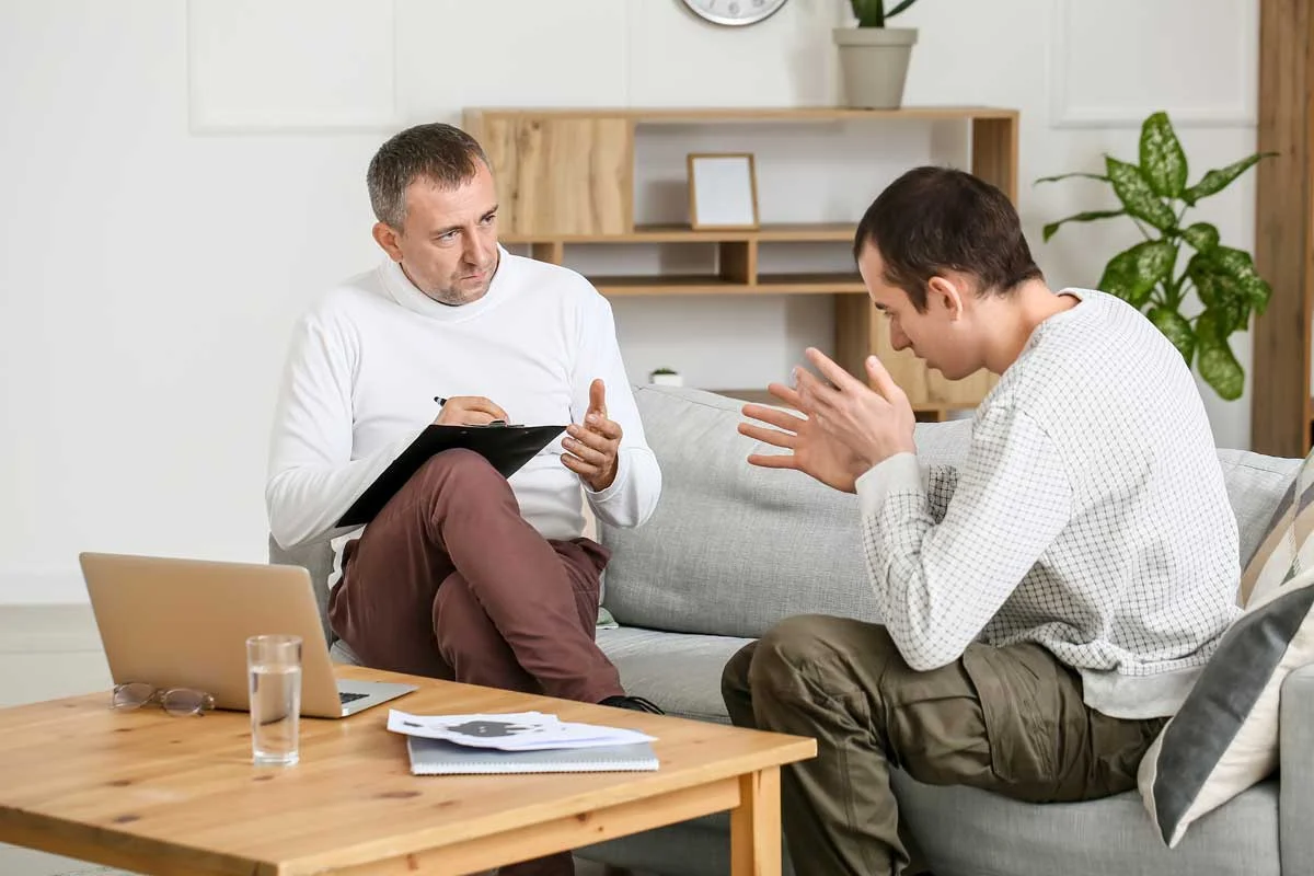 A man is participating in individual therapy with his therapist. He is in residential treatment for addiction recovery at Spring Grove Reovery.