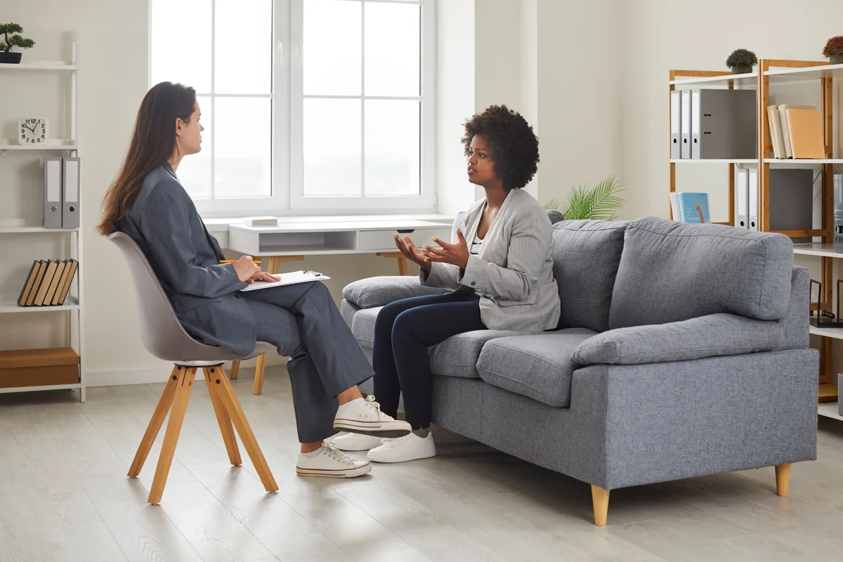 Patient speaking to counselor in office