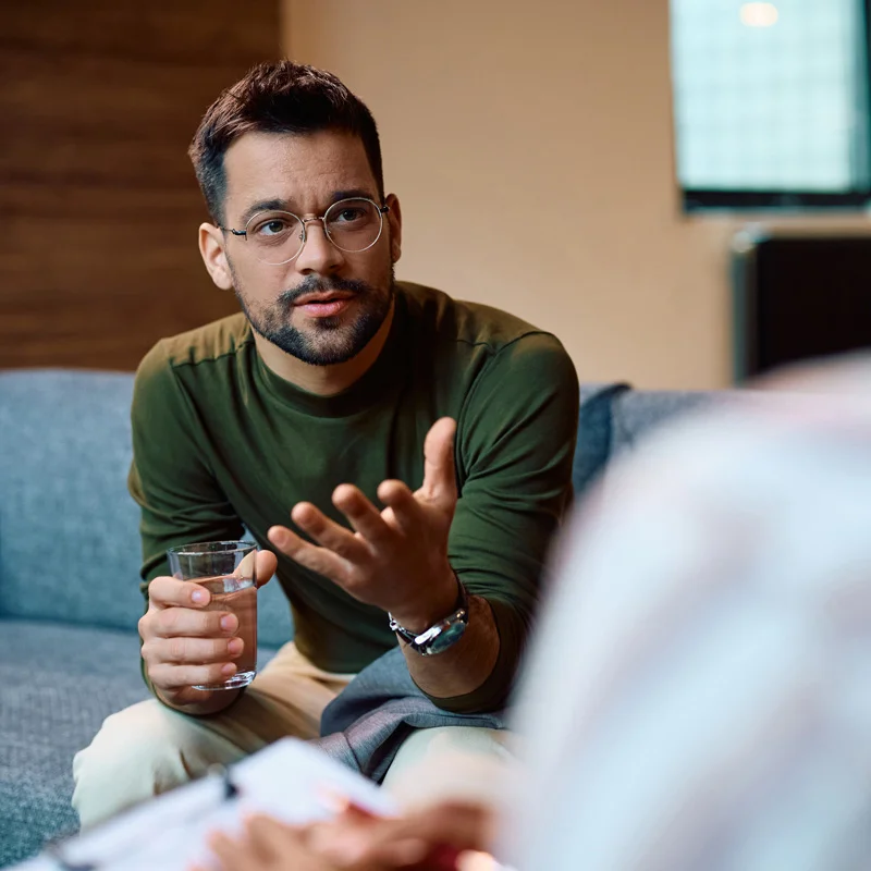 Man speaking to counselor