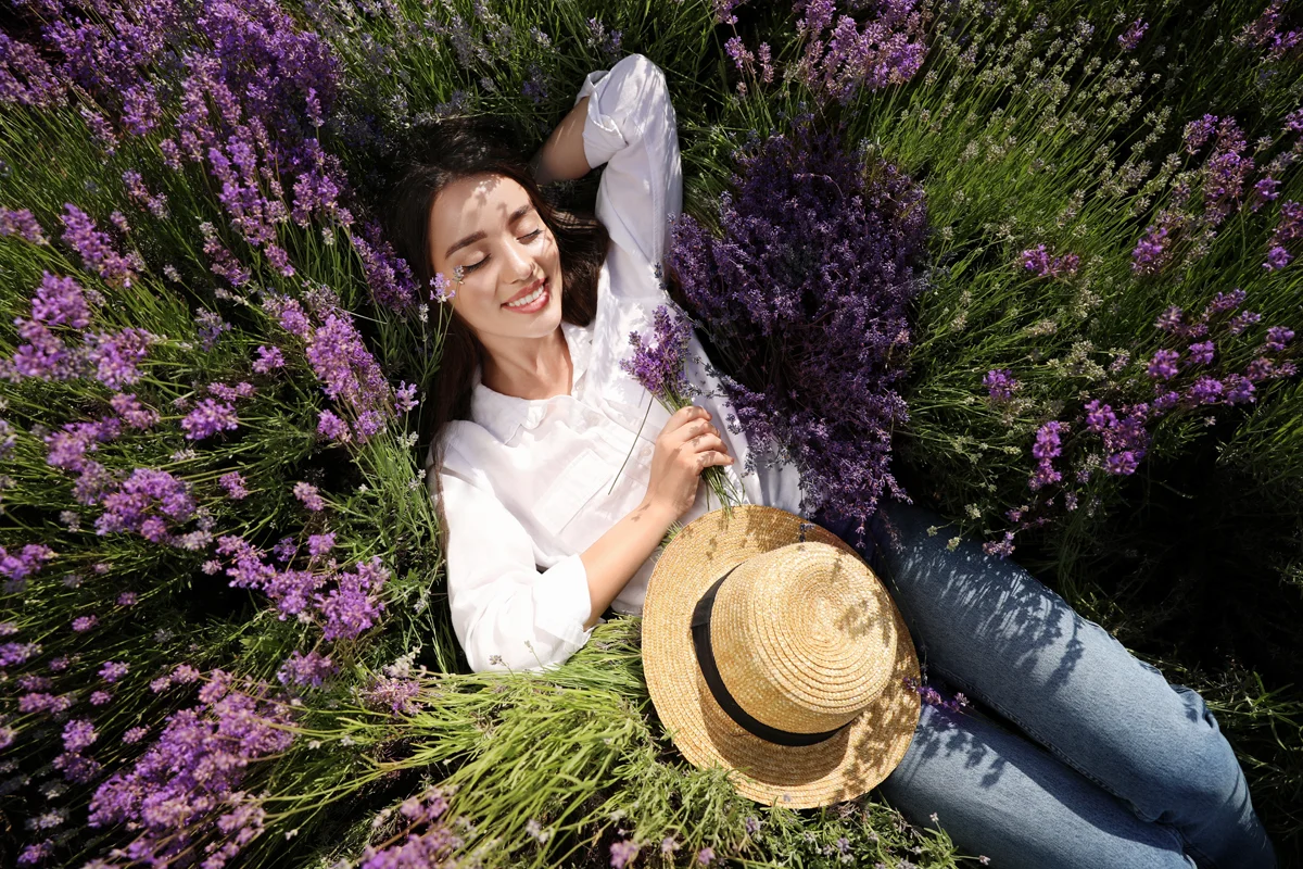 Woman laying in lavender field