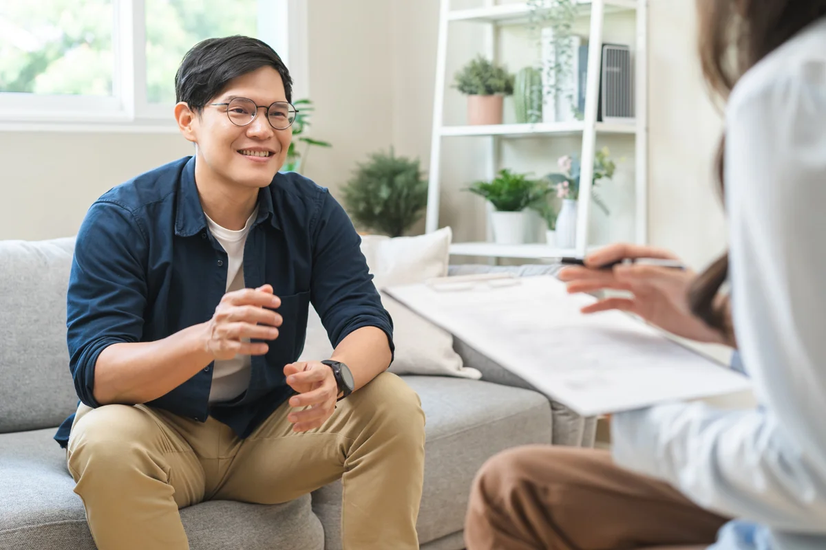 Man smiling in therapy session